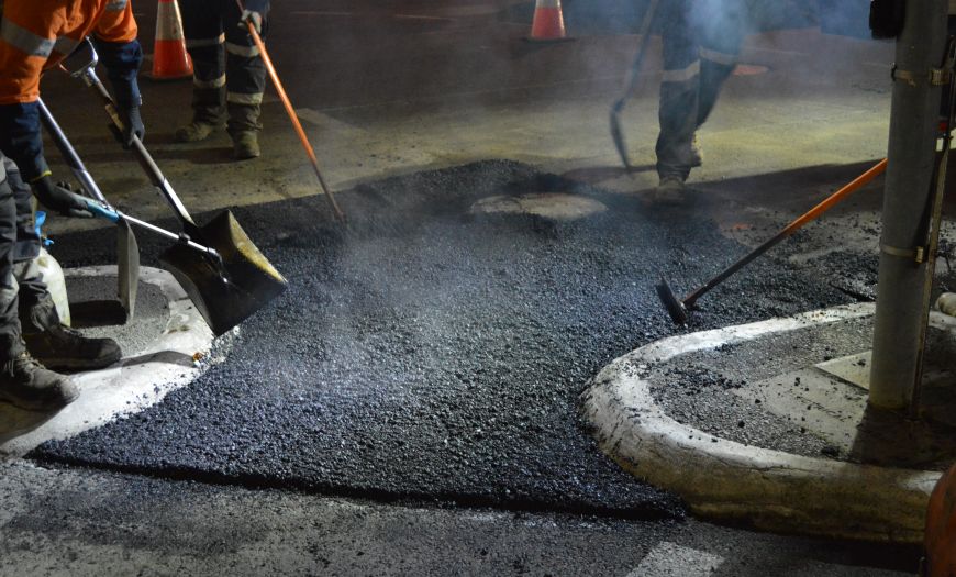 Bitumen being laid as part of the South Road rehabilitation works
