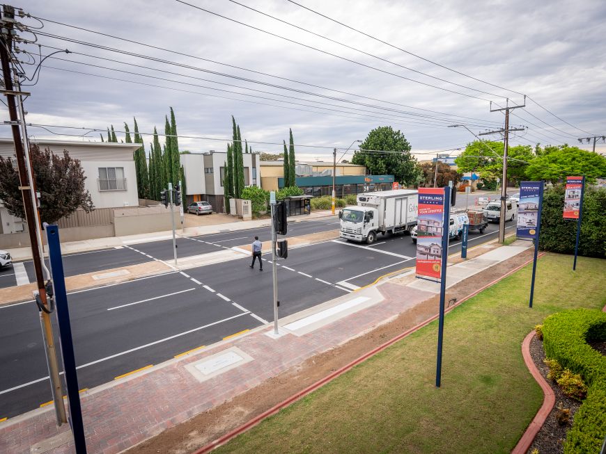 Pedestrian crosses Grange Road, Allenby Gardens using new crossing