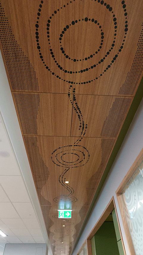 Artwork along ceiling representing Seven Sisters Songline and Tjukurpa.