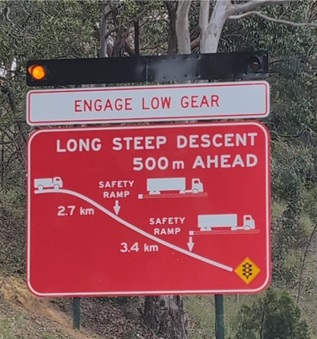 Road sign - long steep descent ahead