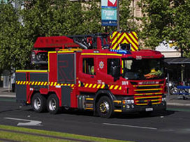 A fire engine driving on the road.