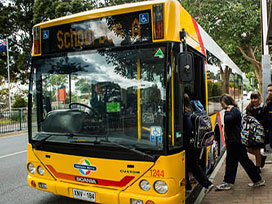 A school bus that has set down to pick up school children.