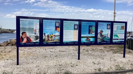 An information board with six panels at the North Haven boat ramp.