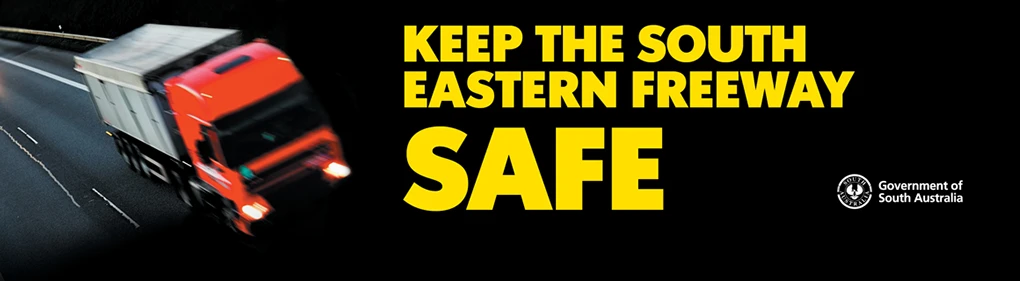 A stylised truck driving along the freeway and the words "Keep the South Eastern Freeway safe".