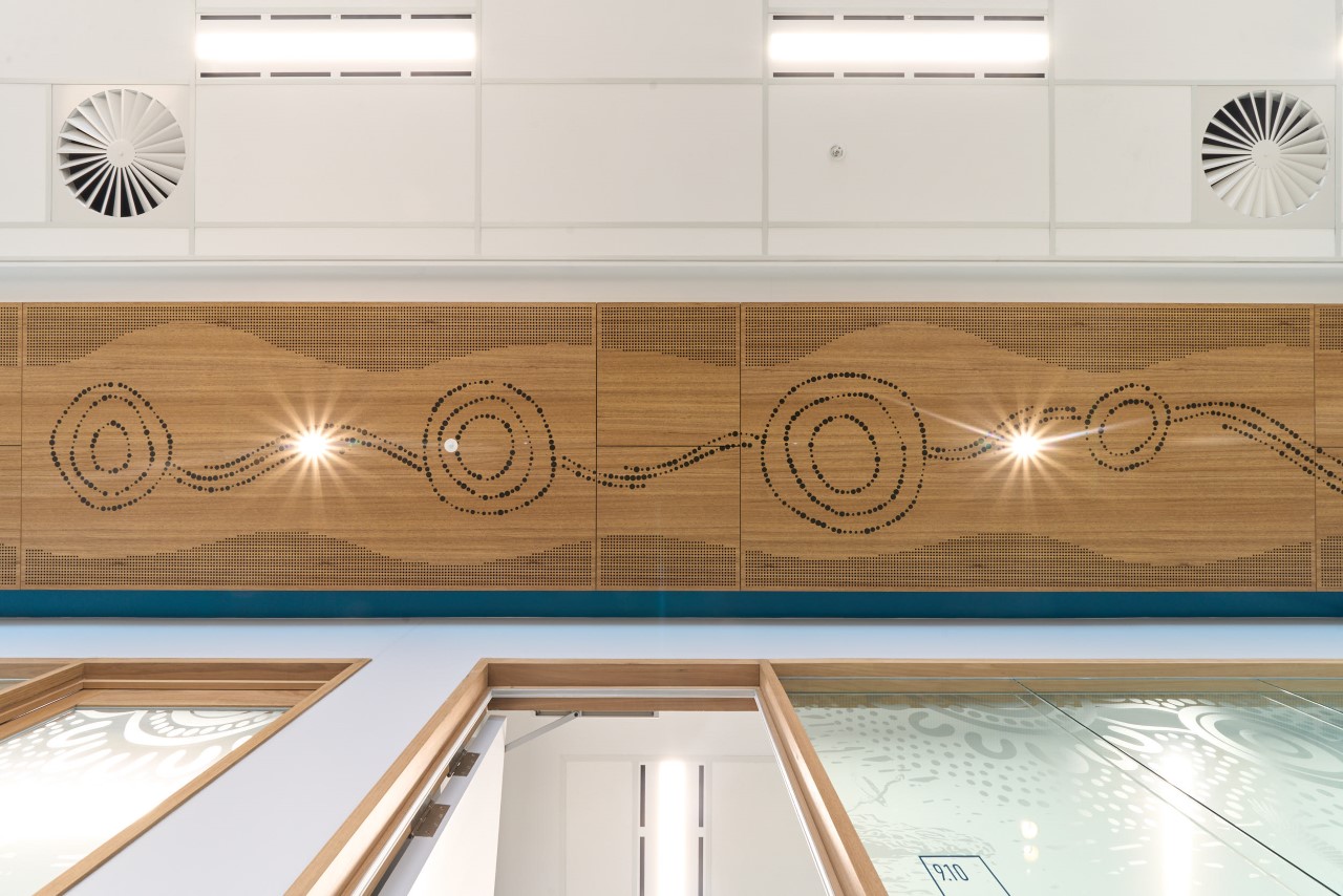 Artwork along ceiling representing Seven Sisters Songline and Tjukurpa.