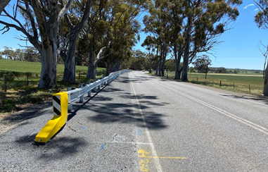 Shoulder sealing along a road.