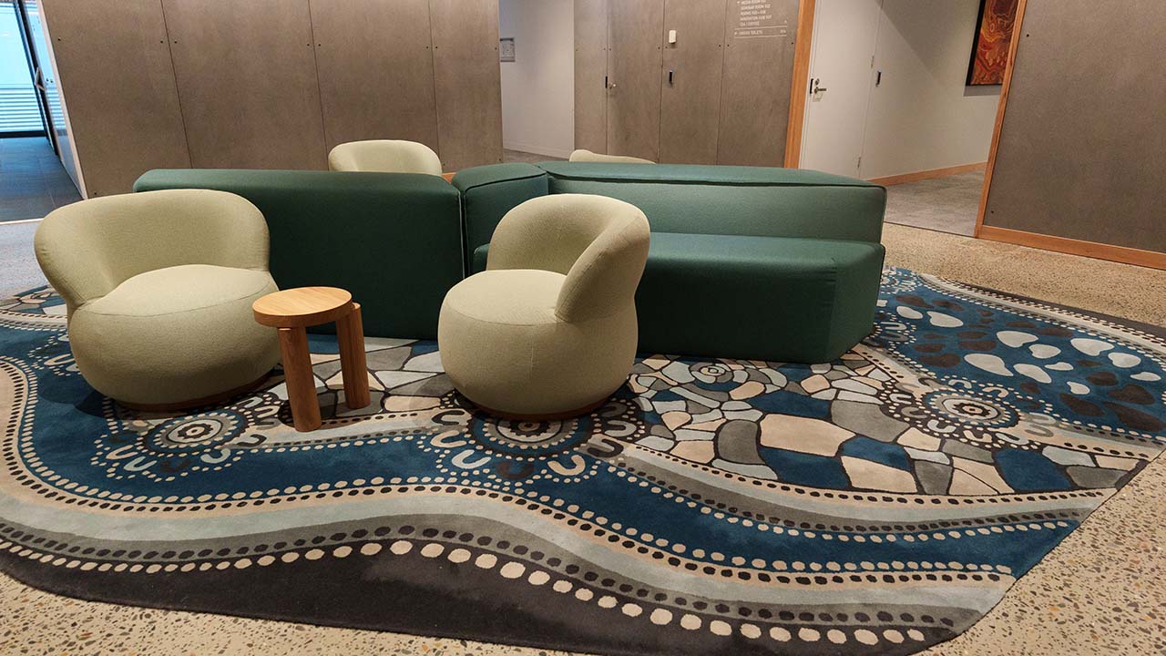 The rug and sofas in the reception area.