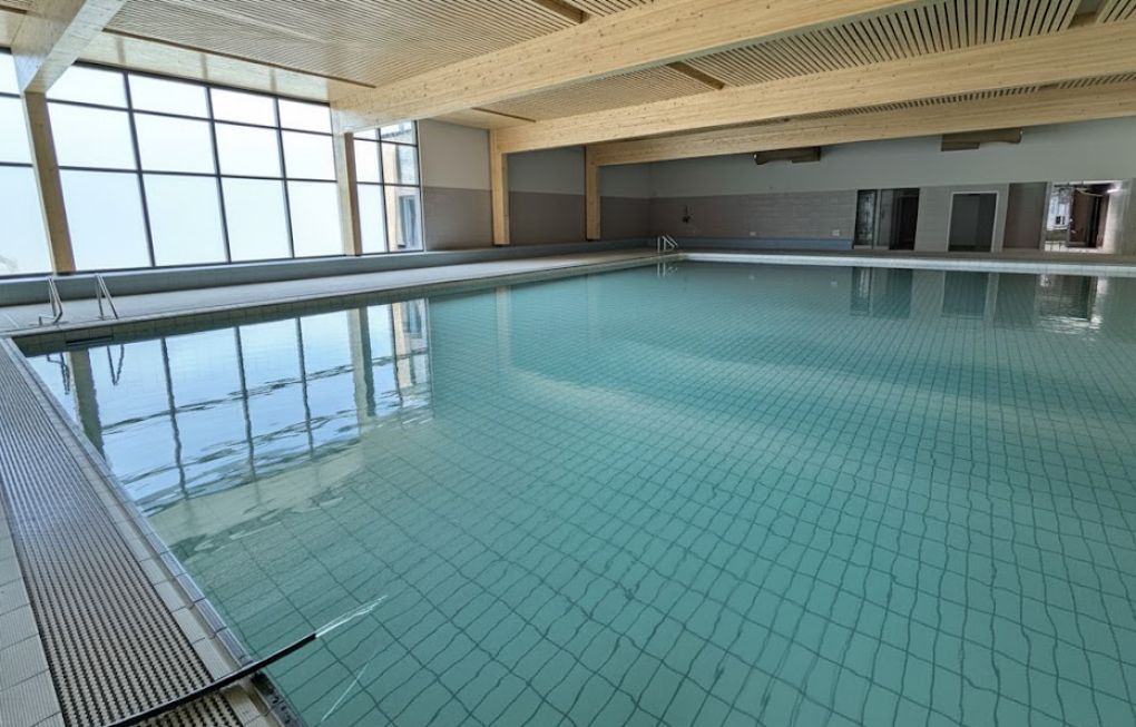 A hose filling the pool at the Aquatic Centre