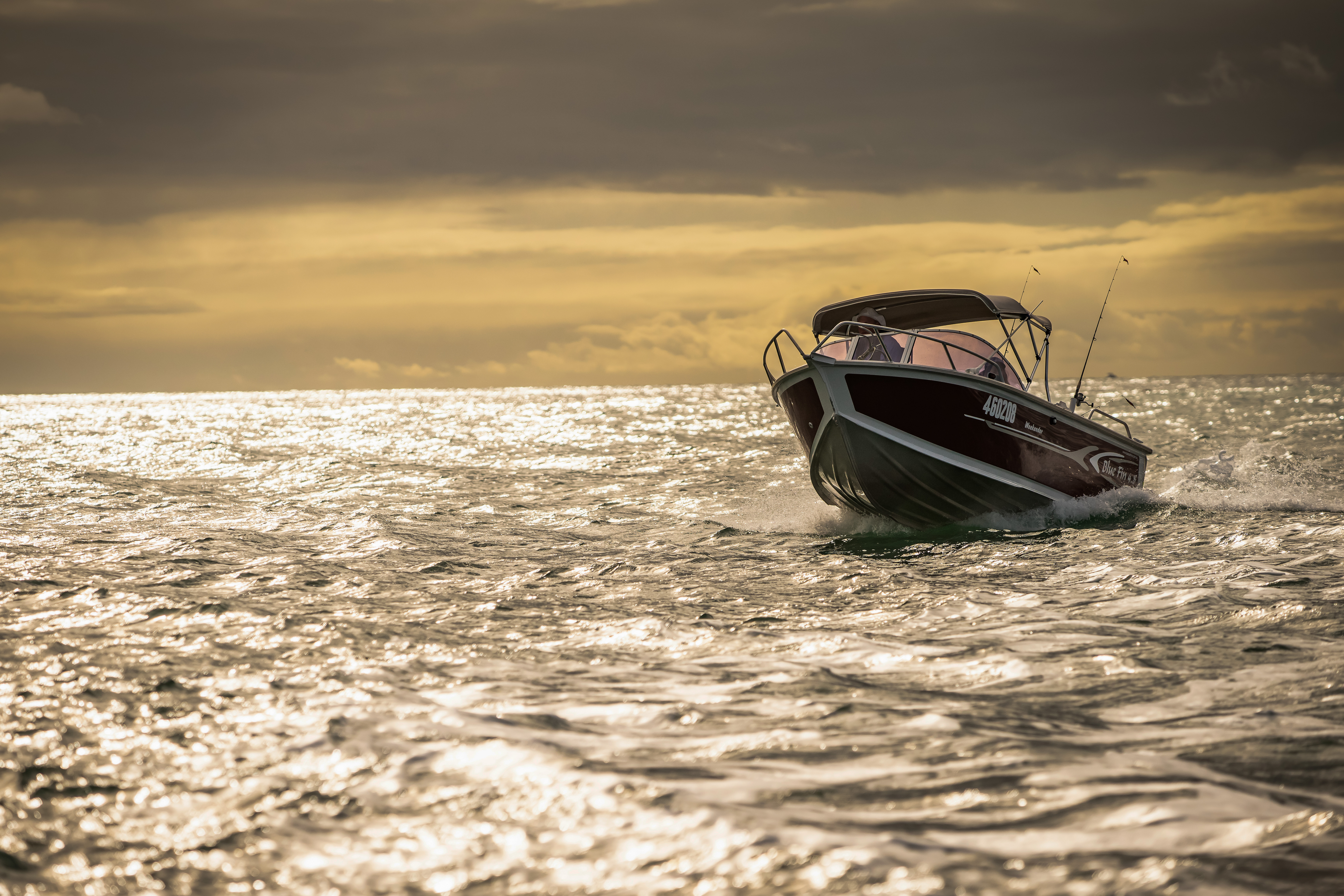 Boat on water with clouds coming in