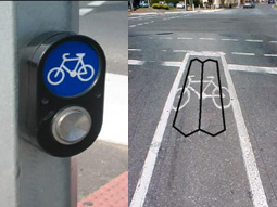 A bicycle crossing button and representation of rider detection overlaid on a bicycle lane at the stop line.