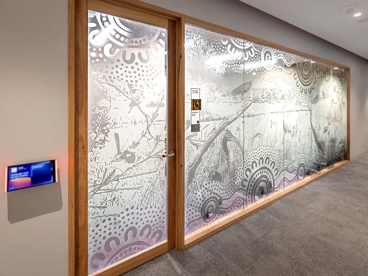 Artwork on the glass walls of meeting rooms depicting the Lakes/Rivers theme.